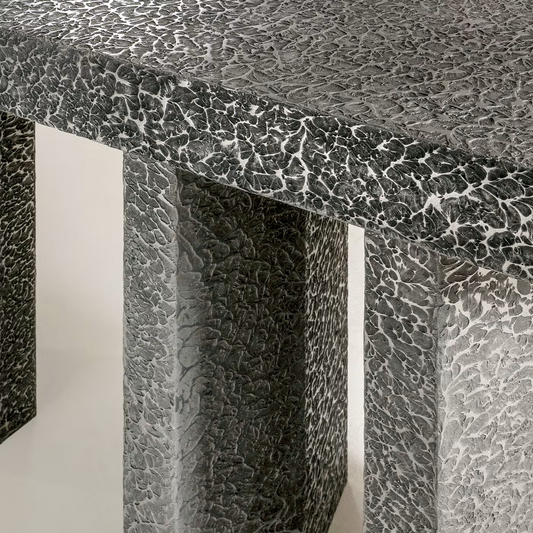 Imperfetto asymmetrical three-legged liquid metal tin console