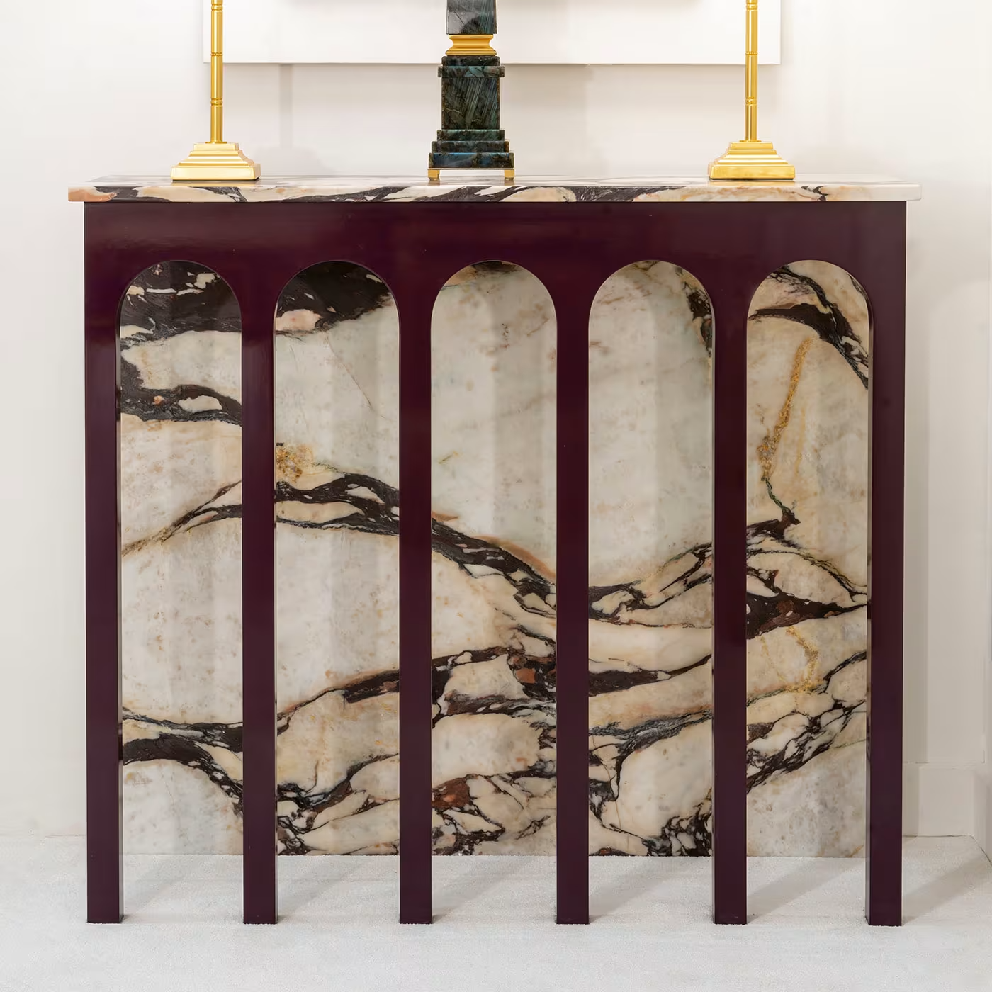 Arched console in onyxed breccia marble