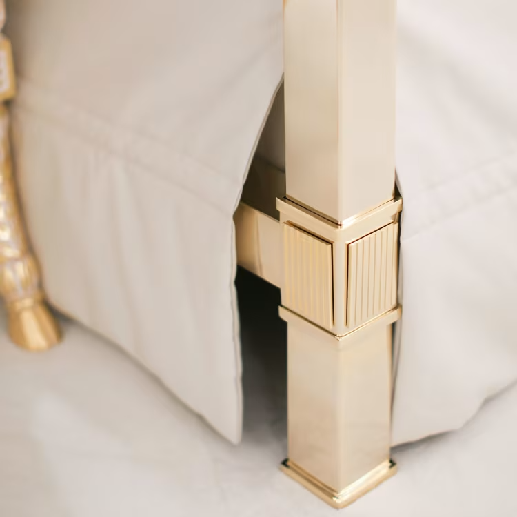 White leather and golden bronze double canopy bed